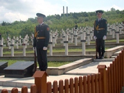 Servicemembers Take Care of the Graves of Soldiers Dead in War